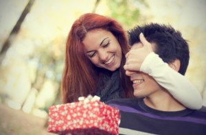 girl-surprising-her-boyfriend-with-gift